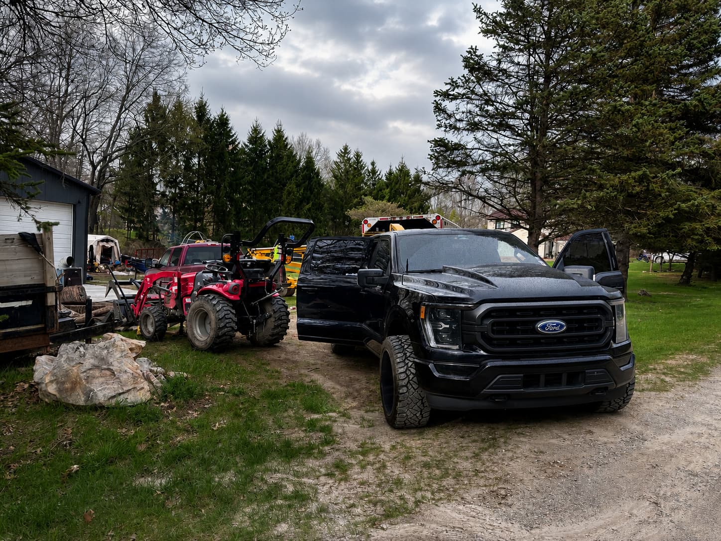 Miles Ironworks truck beside a logging tractor during an emergency on-site repair